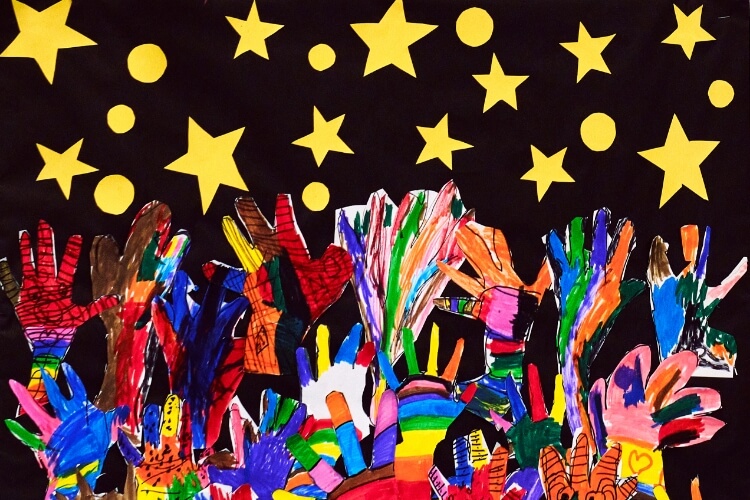 a drawing of hands reaching for the stars